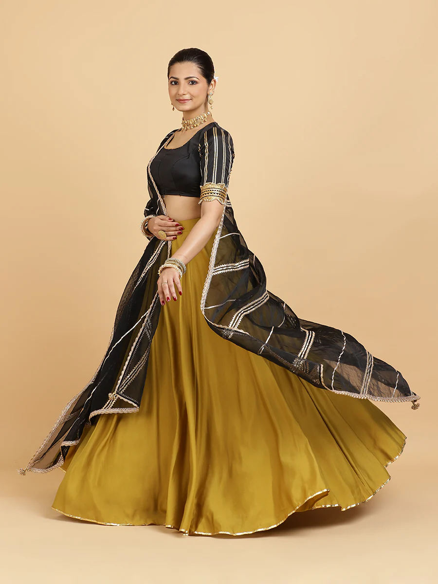 Jhalak Aziza 4-Pc Lehenga Set x Tyohaar | Mustard Lehenga, Charcoal Black Blouse with Chandni Black Dupatta and Cancan Skirt - Image 5