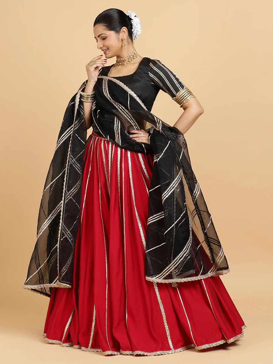 Madhuri Aziza 4-Pc Lehenga Set x Tyohaar | Red Lehenga, Charcoal Black Blouse with Chandni Black Dupatta and Cancan Skirt - Image 2
