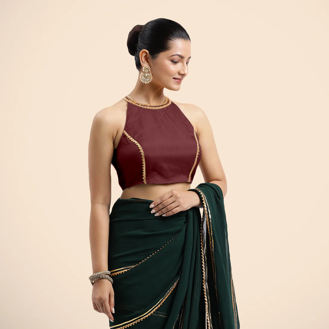 Zubeida x Tyohaar | Burgundy Halterneck FlexiFit™ Saree Blouse with Elegant Golden Gota Embellishment on Princess Line