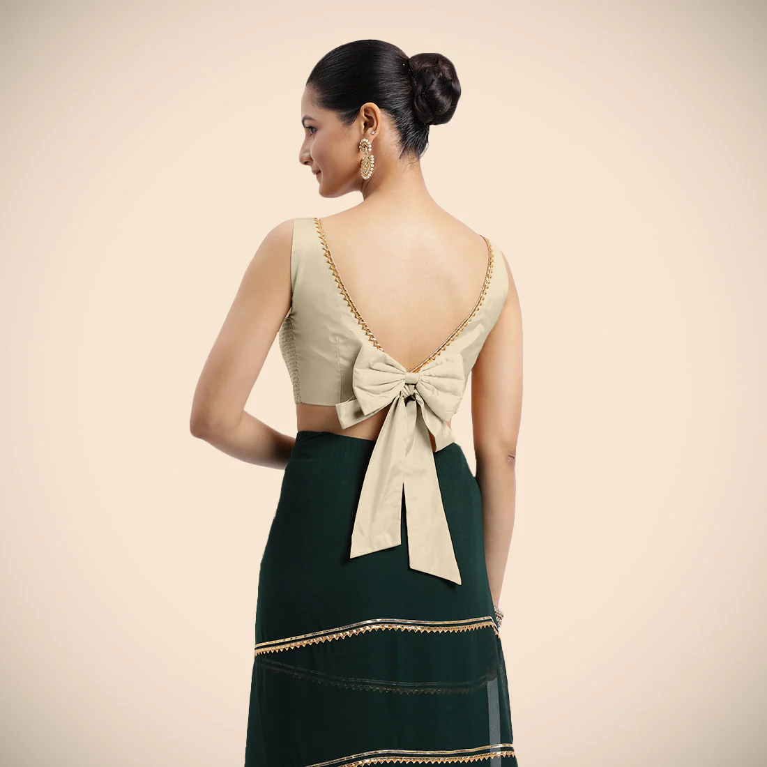 Sherry x Tyohaar | Cream Sleeveless FlexiFit™ Saree Blouse with Simple Golden Gota Lace on Neckline and Removable Bow on Back - Image 2