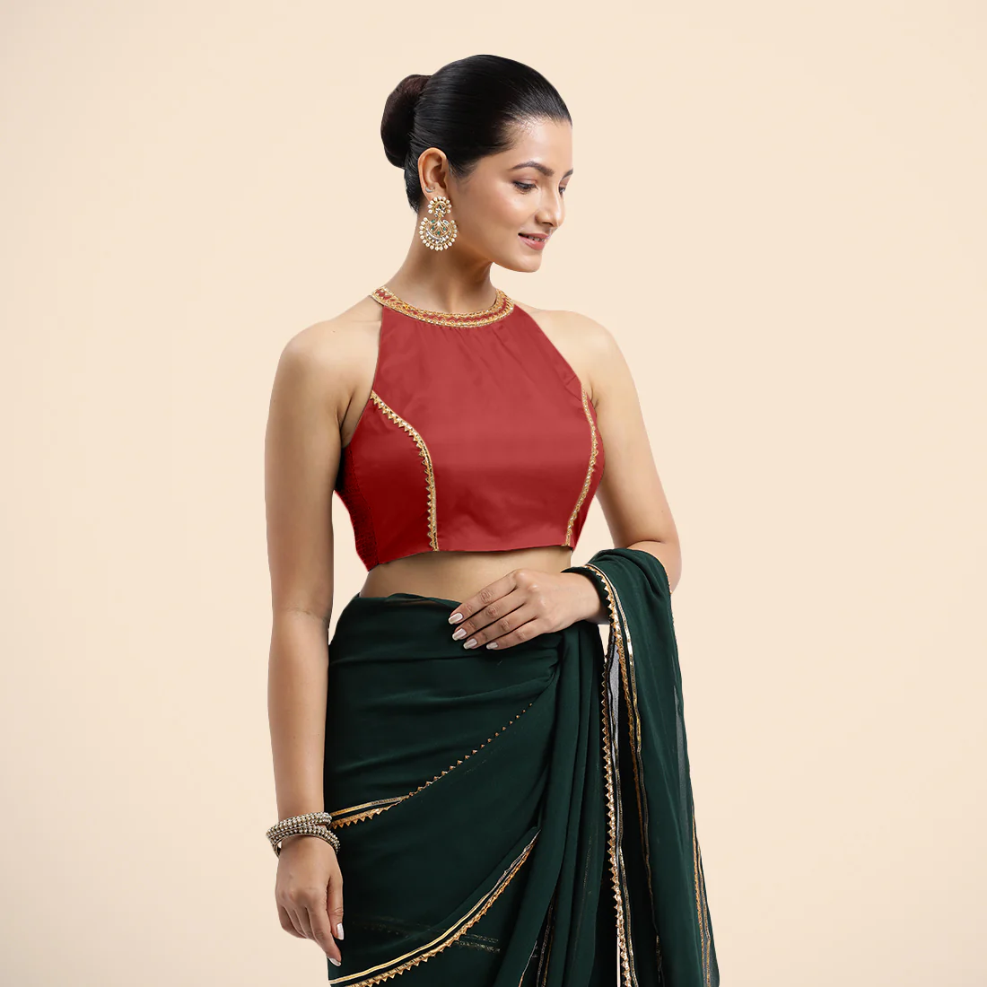 Zubeida x Tyohaar | Crimson Red Halterneck FlexiFit™ Saree Blouse with Elegant Golden Gota Embellishment on Princess Line